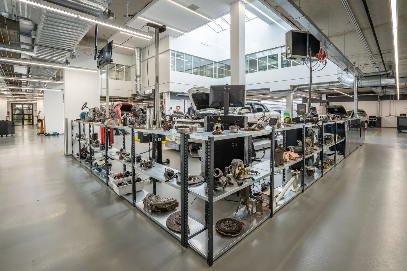 Aftermarket auto parts organized on warehouse shelves in a modern parts distribution facility